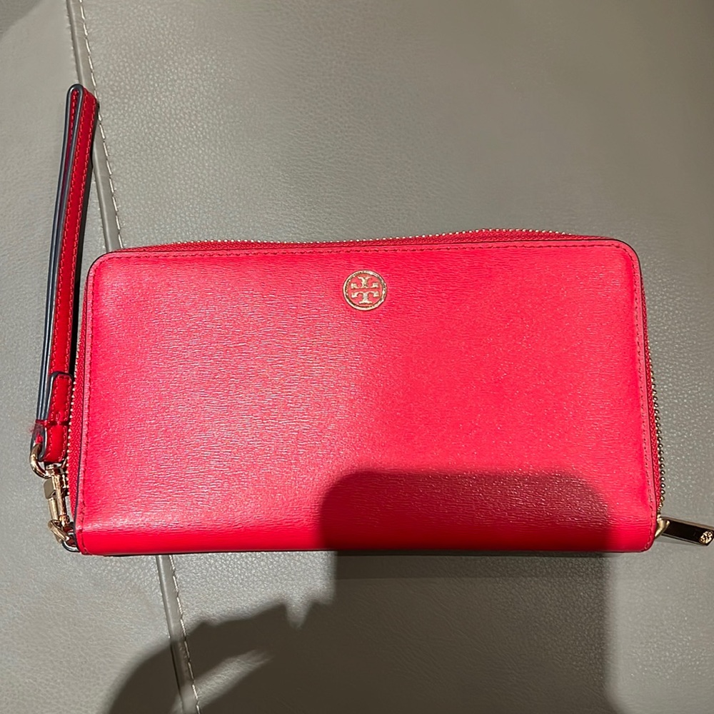 Slightly used authentic red outside dark navy blue inside Tory Burch wallet